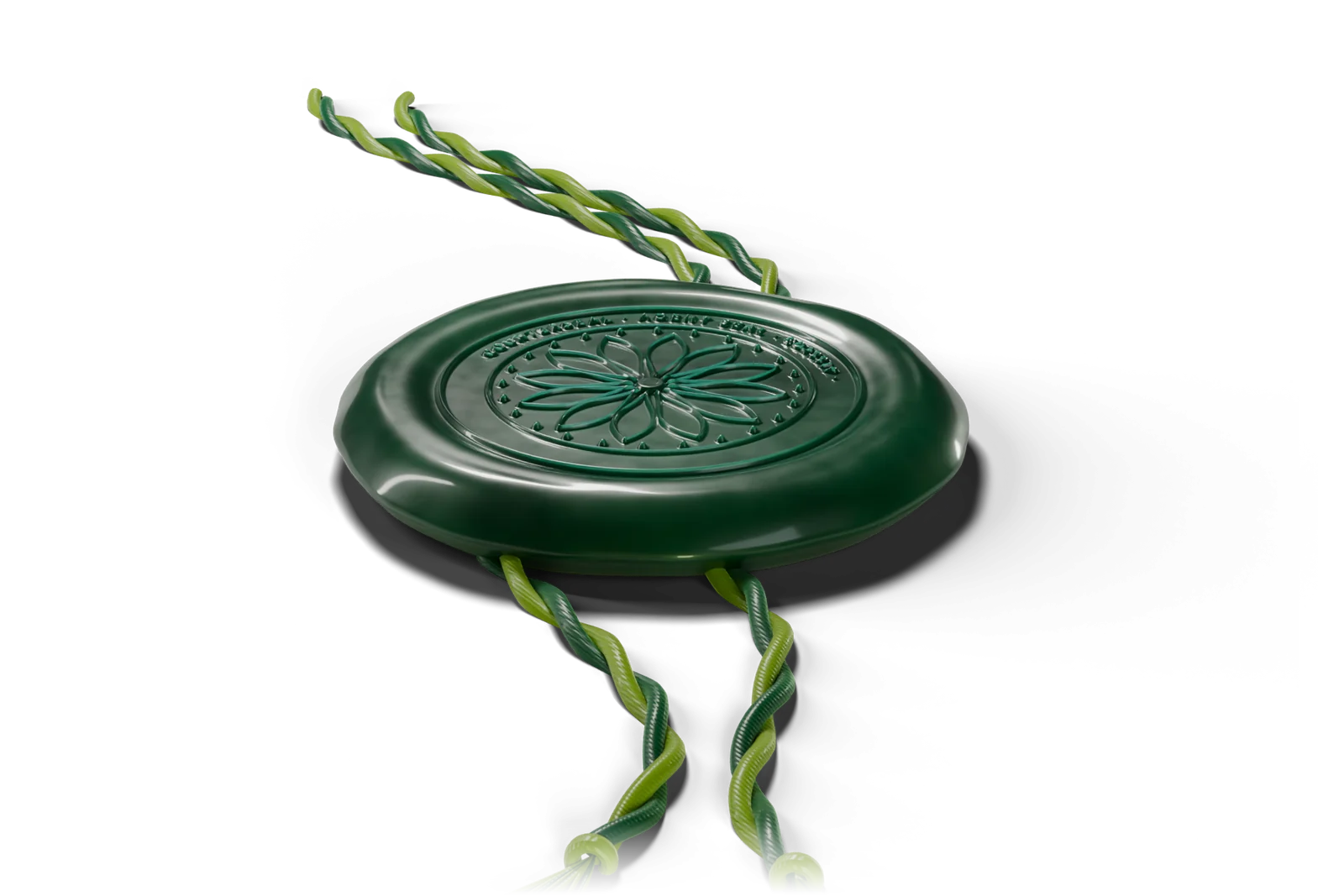 A green wax seal on twisted silk cords, lying on a dark table